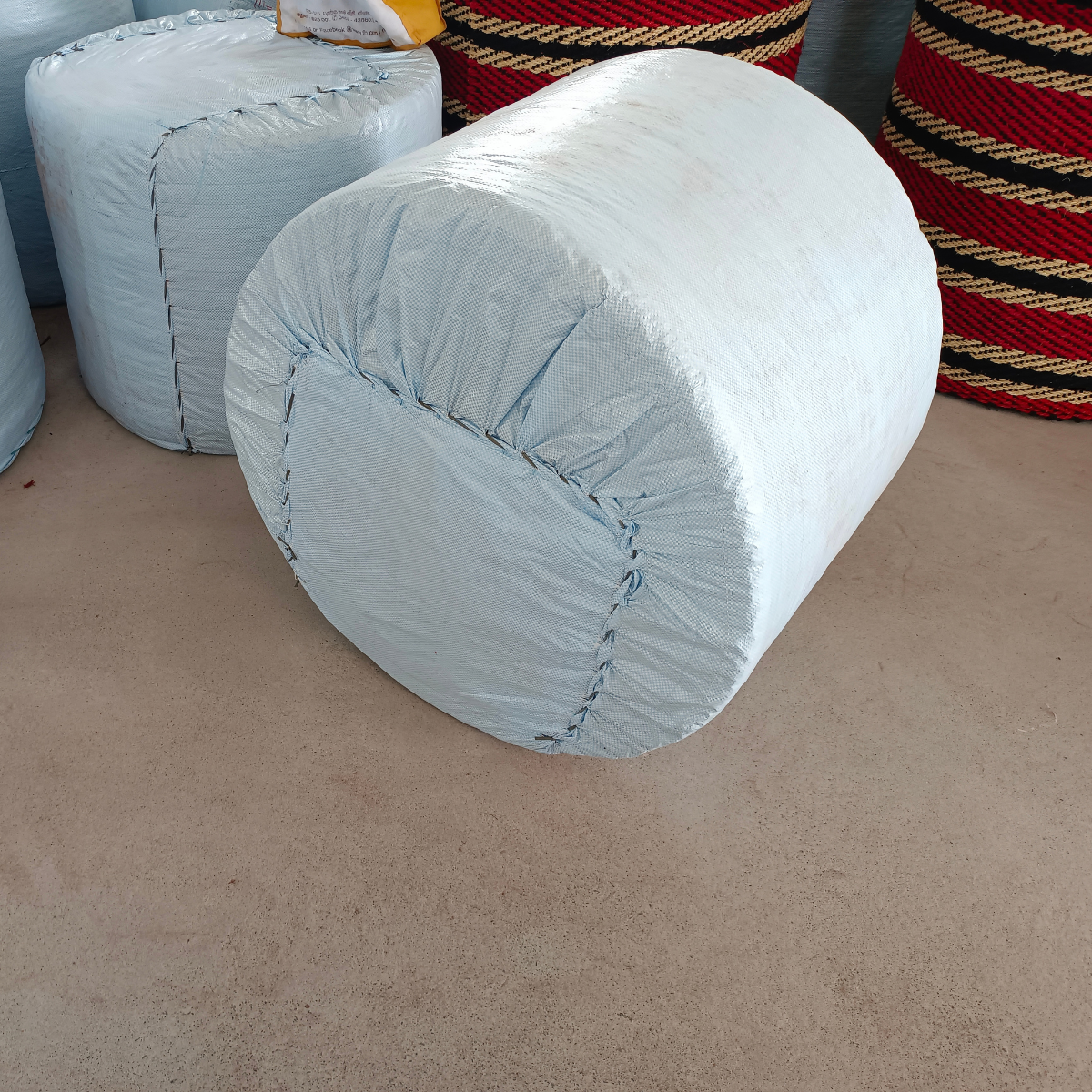 Close-up view of a single wrapped coir matting roll