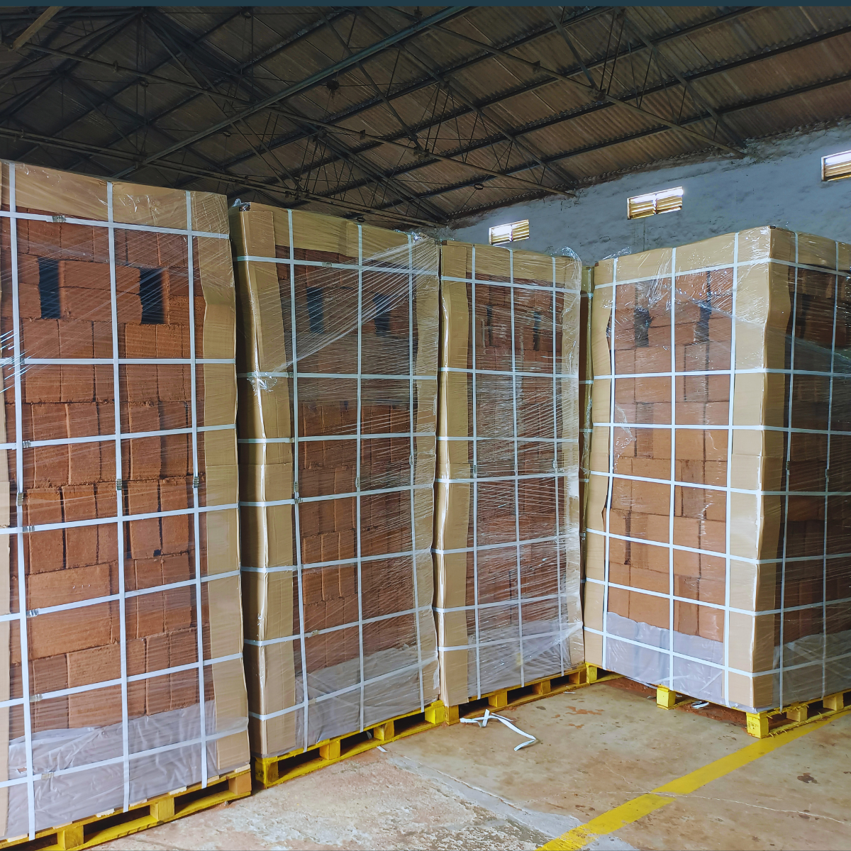 Coco peat blocks stacked and stretch wrapped on pallets